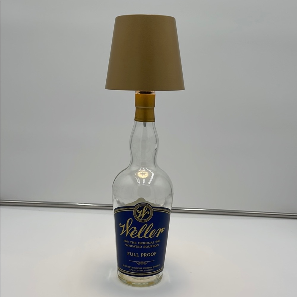 Bottle Lamp with Gold shade.